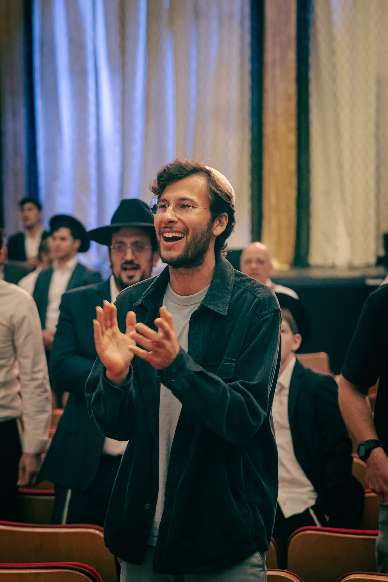 Raphael clapping and singing at a musical hallel