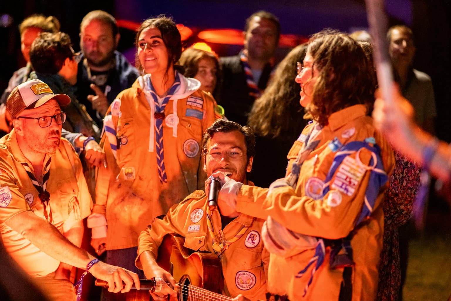 A musical gathering, singing together at night